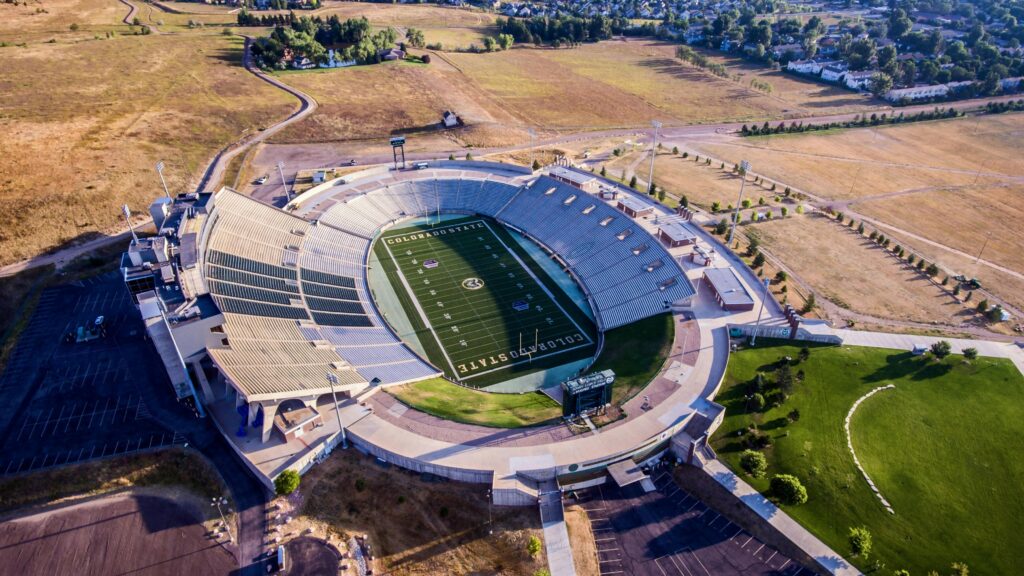 Captivating aerial shot of Hughes Stadium in Fort Collins, showcasing its modern design and scenic surroundings.